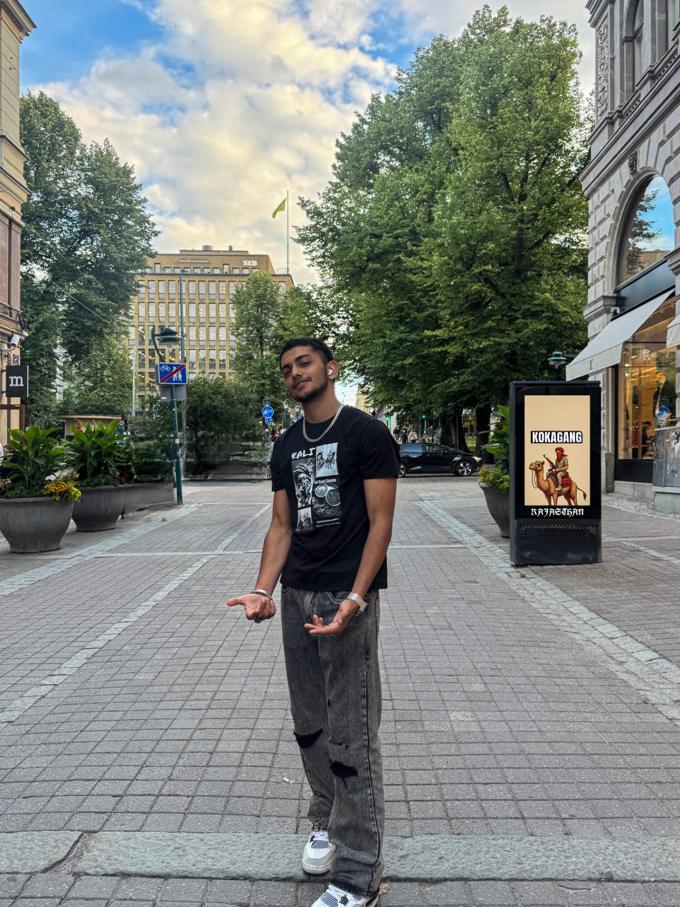 Wearing the black Kali Rajasthani graphic tee on a street in Helsinki